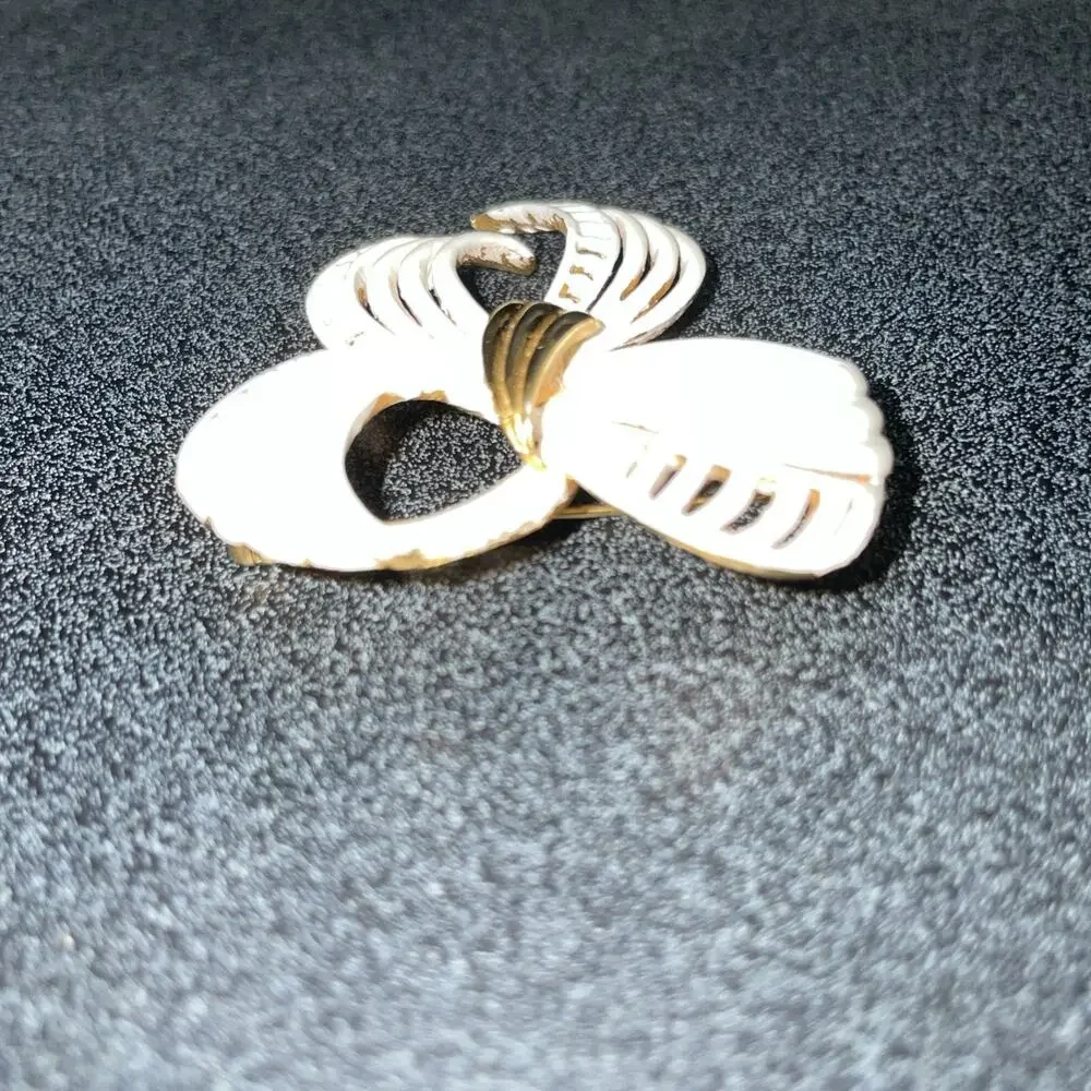 Vintage MONET Gold Tone, White Enamel Fancy Bow Design Brooch Stamped